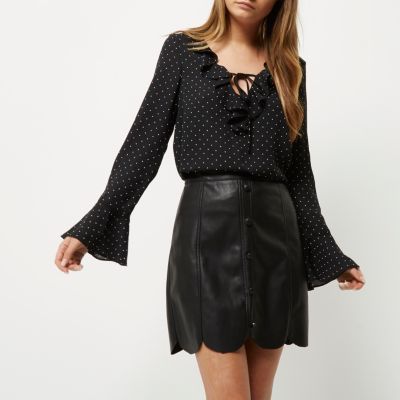 Black leather look scallop hem mini skirt